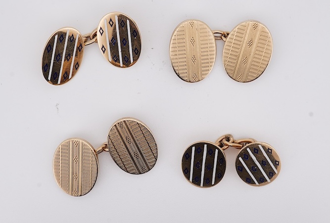 A pair of early to mid 20th century Austro Hungarian yellow metal and two colour enamel set oval cufflinks and a pair of 1930's engine turned 9ct gold oval cufflinks, gross weight 22 grams. Condition - fair